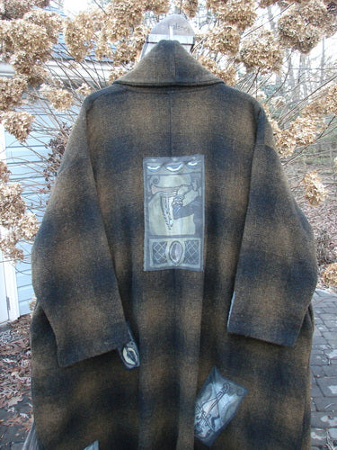 1995 Patched Theater Coat Music Man Cottage Brown Plaid OSFA: A cozy oversized coat with a Music Man Center Patch. Vintage button closure, A-line shape, foldable cuffs, and deep side pockets.