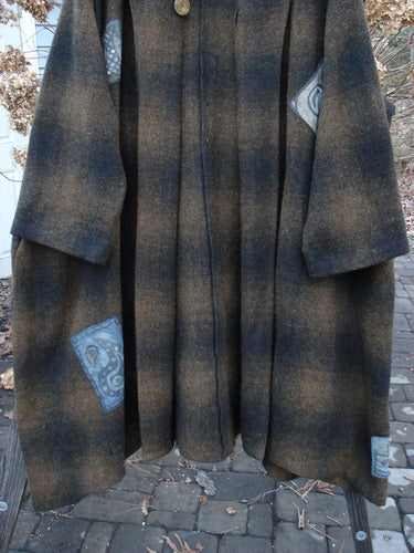 1995 Patched Theater Coat Music Man Cottage Brown Plaid OSFA: A long plaid coat with an oversized vintage button closure, A-line shape, and deep side pockets. Cozy and unique, this coat features unreal patches, foldable cuffs, and longer sleeves.