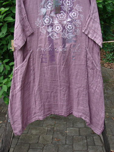 Barclay NWT Linen Wave Urchin Dress Circle Garden Tulsi Rose Size 0, featuring a subtle floral pattern, displayed hanging on a line, exemplifying BlueFishFinder.com's commitment to creative, vintage styles.