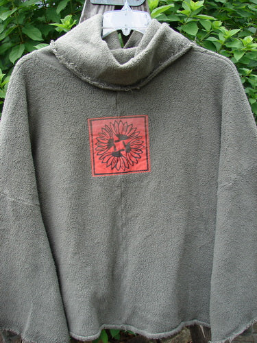 Barclay Sherpa Patched Wide Cowl Pocket Pullover Unpainted Sea Moss OSFA features detailed red square patches with bird and flower designs, showcasing the unique creativity of BlueFishFinder's vintage-inspired collection.