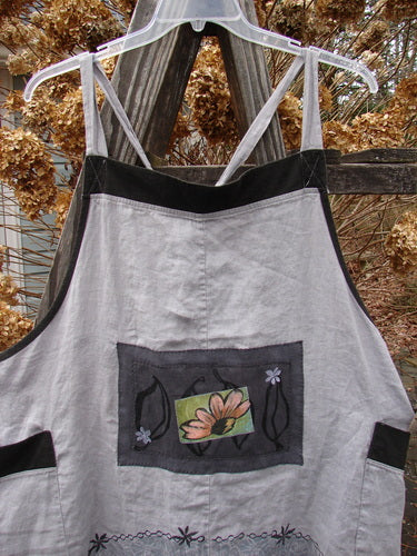 Image alt text: Barclay PMU Patched Linen Contrast Apron Jumper with flower and patch details