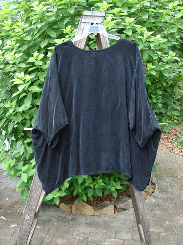 Barclay Velvety Cupro Drape Square Top Celtic Botanicals Black OSFA displayed elegantly on a wooden frame, showcasing its luxurious drape and intricate design, embodying Bluefishfinder.com's vintage, expressive clothing ethos.