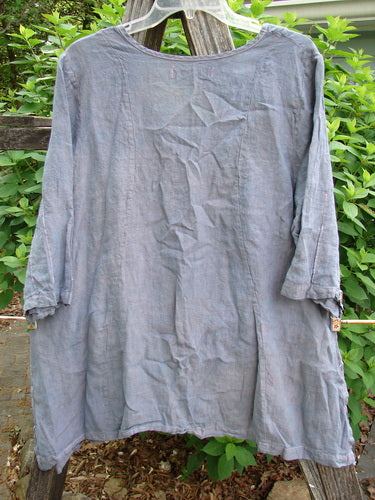 Barclay Contrast Stitch Springtime Top in unpainted mottled grey lilac, featuring contrasting stitchery, curvy seams, sweet pinched sleeves, and an oval neckline, offering a flowy A-line shape.