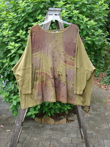 Barclay Dolman Sleeved Pullover Top Wind & Rain Peapod OSFA displayed on a clothes rack; featuring a relaxed fit and long sleeves.