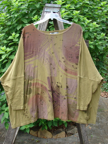 Barclay Dolman Sleeved Pullover Top Wind & Rain Peapod OSFA displayed on a swinger, highlighting its unique dolman sleeves and relaxed fit, embodying the creative spirit of Vintage Blue Fish Clothing.