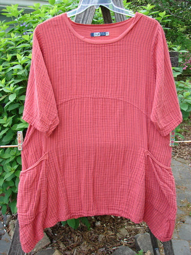 Barclay Gauze Two Pocket Urchin Dress in Geranium Stripe, featuring a flutter neckline, three-quarter sleeves, and wrap drop pockets, reflects Bluefishfinder.com's vintage, expressive style.