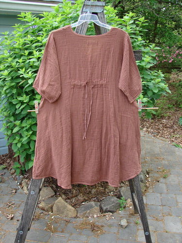 Barclay Gauze Key Pocket Everyday Dress in Copper Stripe, featuring a unique keyhole neckline, A-line shape, triangular drop pockets, and sectional panels, showcased on Bluefishfinder.com for creative self-expression.
