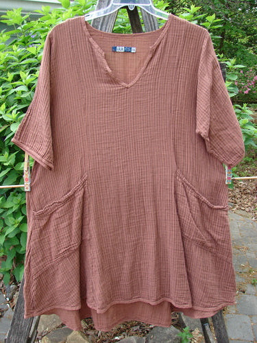 Barclay Gauze Key Pocket Everyday Dress in Copper Stripe features a unique keyhole neckline, A-line shape, three-quarter sleeves, triangular drop pockets, drawcord back, and sectional panels.