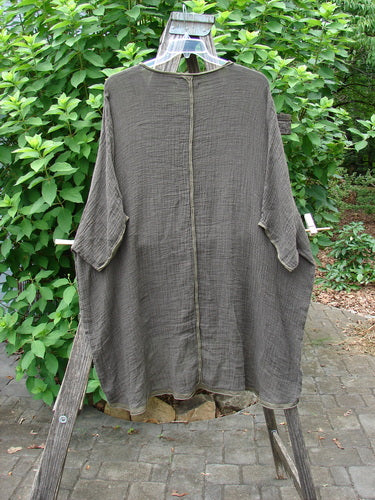 Barclay Gauze Linen Exterior Curve Hi Low Pullover Unpainted Stick OSFA displayed on a clothes rack, showcasing its unique design with long sleeves and flowing silhouette, embodying Bluefishfinder.com's vintage, expressive style.