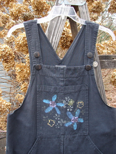 2000 Parachute Overall Jumper with floral painted bib pocket and adjustable shoulder straps. Lightweight cotton fabric. Size 0.