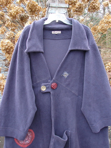 Barclay Celtic Moss Patched Highlander Coat: A plush, heavyweight purple coat with oversized vintage buttons and diagonal seams.
