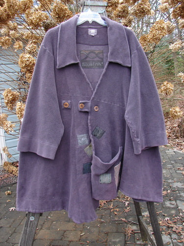 2000 PMU Celtic Moss Highlander Coat Aubergine Size 1: A plush, heavy purple coat with empire waistline, multiple patches, and big collared front.