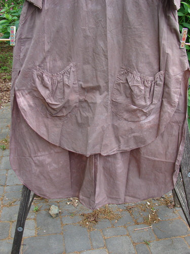 Barclay Percale Key Pocket Hi Low Dress Mottled Mocha Size 0, featuring a key neckline, dual elastic-topped pockets, wide sleeves, and a rounded front-back length with side vent and rear gatherer.