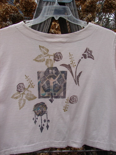 1994 Spruance Vest with rose and leaf design, worn open over white shirt with skull print, on wood surface"