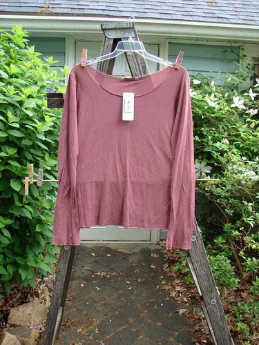 Barclay NWT Modal Batiste Layer Top in Desert Rust features long sleeves, raw edges, a deeper neckline, and slight A-line flair, embodying Bluefishfinder's vintage-inspired, creative fashion ethos.