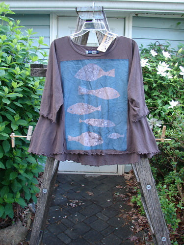 The Barclay NWT Three Quarter Sleeved Cafe Tee Fish Brown Sparrow Size 0 features a mid-weight organic cotton with an A-line shape, rolled neckline, and curly edges, embodying a whimsical fish theme design.