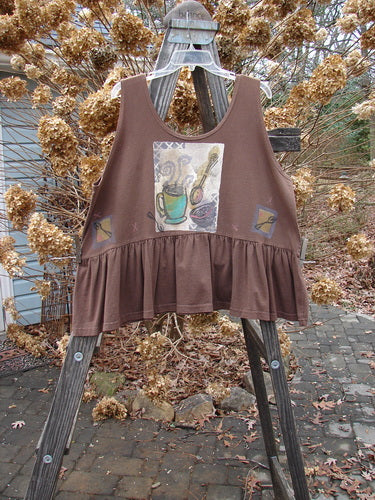 1992 Peplum Top: Brown shirt on wooden ladder. Brown tank top with picture. Painting of cup and spoon. Close-up of plant and drain.