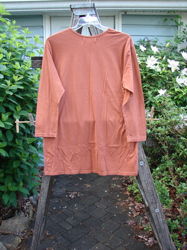 Barclay NWT Long Sleeved Studio Tee features a rounded neckline and straight shape with long sleeves, adorned with a primitive metallic theme, perfect for expressing individuality in BlueFishFinder's vintage style.