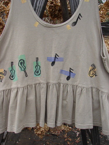 1992 Peplum Top Music Festival Wheat OSFA: Grey shirt with musical notes painted on it, baby doll style flounce top with wide waist and gathered bottom flounce. Perfect for layering!