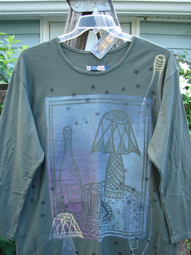 Barclay NWT Long Sleeved Studio Tee in Shadow Garden Green, featuring a straight shape, long sleeves, and rounded neckline with a Cheers Celebration theme, size 0 from BlueFishFinder.com.