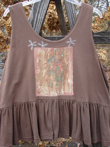 1992 Peplum Top Magic Chair Mushroom OSFA: A brown tank top with a picture on it. Features a yoked waist seam, rounded neckline, and wide waist measurement. Includes Blue Fish patches and a gathered bottom flounce.