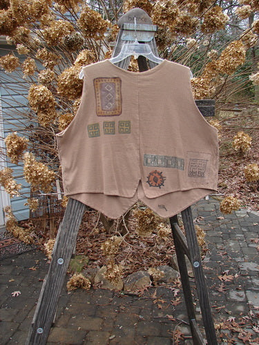 1995 Cottage Vest Geometrics Cottage Brown OSFA: A close-up of a vest with a ceramic button front, tailored back hemline, and a vintage geometric theme.