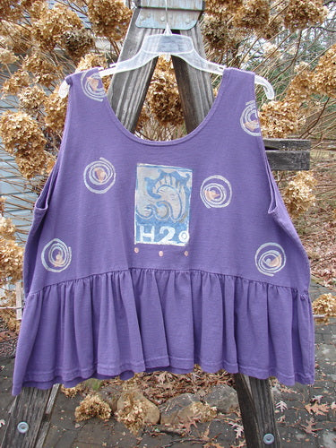 1992 Peplum Top Spinner Deep Violet OSFA: A patchwork flounce top with a rounded neckline, wide waist, and gathered bottom. Vintage H2O Spinner theme.