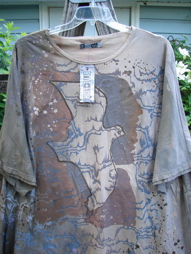 Barclay NWT Art Tee Mountain Dove Cafe Au Lait OSFA features a tunic length, drop shoulders, loose three-quarter sleeves, and a varying hemline. It embodies the creative freedom BlueFishFinder.com celebrates.