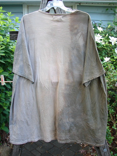 Barclay NWT Art Tee Mountain Dove Cafe Au Lait OSFA displayed, showcasing a tunic length with drop shoulders, loose three-quarter sleeves, rounded neckline, varying hemline, emphasizing creative individuality from Bluefishfinder.com.