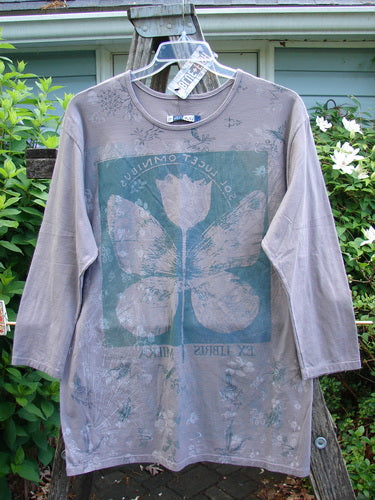 Barclay NWT Long Sleeved Studio Tee with a floral wing theme showcases a straight shape, rounded neckline, and cozy sleeves, reflecting Bluefishfinder.com's vintage-inspired, expressive clothing style. Size 0, 32-inch length.