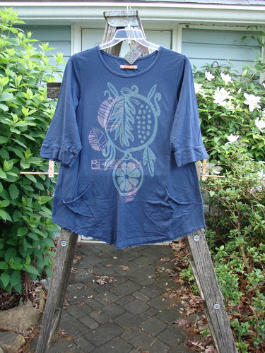 Barclay NWT Banded Artist Pocket Top Mixed Nature Navy Sky Size 1, showcasing a rounded neckline, three-quarter banded sleeves, double diagonal pockets, and a flattering A-line shape with unique curly edges.