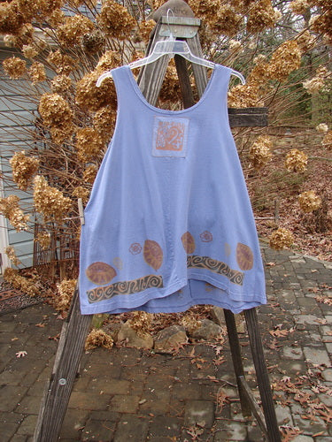 1993 Solo Tank Wonderland Periwinkle OSFA: A blue tank top with a unique vertical center front seam and a diagonal rear seam creating a back swing. Fairly deep arm openings and neckline. Bust 52, Waist 54, Hips 56, Length 32 inches.