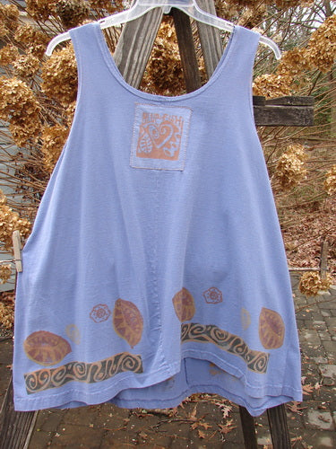1993 Solo Tank Wonderland Periwinkle OSFA: A blue tank top with a unique design of brown leaves. Features a cool rounded lower cut, deep arm openings, and a slight tapered lower hem. Perfect for a short dress or longer tank.
