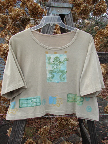 1992 Short Sleeved Crop Tee Top Frog Camino OSFA: A vintage t-shirt with a frog design, featuring a slightly thicker rolled neckline and super sweet little stamp accents. Own a piece of Blue Fish history with this collectible crop tee.