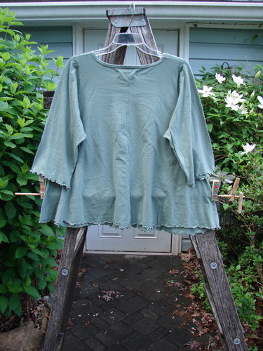 Barclay NWT Three Quarter Sleeved Cafe Corto Tee Sun Gal Leaf Size 0, features a unique A-line shape, rounded neckline, and curly edgings, exemplifying vintage Blue Fish Clothing's creative ethos.