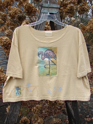 2000 Short Sleeved Crop Tee featuring a colorful flamingo theme paint on a swingy lower shape. Made from organic cotton.