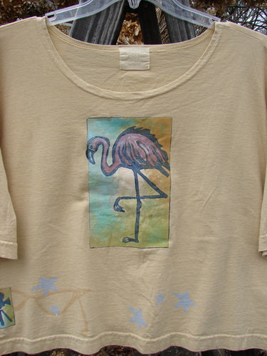 2000 Short Sleeved Crop Tee featuring a playful flamingo theme paint on organic cotton. Fun and colorful, with a wide swingy lower shape and a softly rolled neckline. Perfect condition. Size 2.