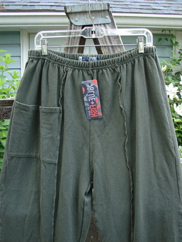 Barclay NWT Rib Single Pocket Exterior Stitch Work Pant Unpainted Army Size 0, featuring a full elastic waist, singular top pocket, wider legs, and vertical stitch detailing, embodying Bluefishfinder's vintage, creative style.