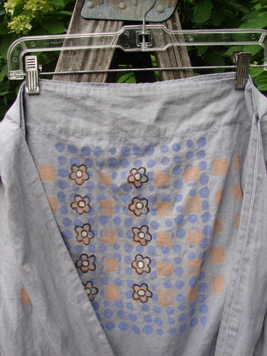 Barclay Linen Sling Tote Daisy Row Lavender OSFA features a light gray fabric with blue dots, peach squares, and floral motifs, showcasing its unique design and vintage appeal from Bluefishfinder.com.