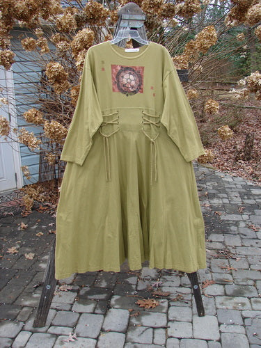 1997 Caryatid Dress in Lantern, Size 2, made of mid-weight organic cotton. Features adjustable front and rear laces, drop shoulders, and an abstract theme paint. Bust 52-60, waist 52-60, hips 62-70, hem circumference 140, length 56 inches.