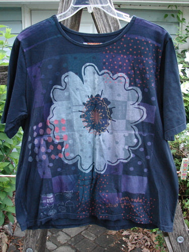 Barclay Short Sleeved Tee Single Floral Black Size 1, showcasing a vintage-inspired floral pattern, embodies the creative and individualistic ethos of BlueFishFinder's vintage Blue Fish Clothing collection.