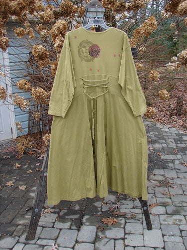 1997 Caryatid Dress, lantern color, size 2, made of organic cotton. Features adjustable laces, drop shoulders, and abstract theme paint. Bust 52-60, waist 52-60, hips 62-70, hem circumference 140, length 56 inches.
