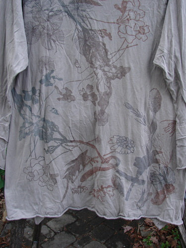 Barclay Petal Sleeve A Line Tunic Floral Dawn Sand Size 1 features a rounded neckline, double petal sleeves, and an A-line shape, showcasing its organic cotton material and floral theme.