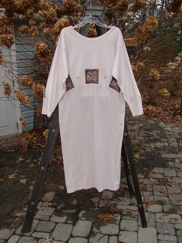 1995 Empire Dress Heart Leaf Champagne Size 1: A white shirt on a rack with a patch and wooden ladder.