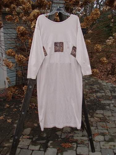 1995 Empire Dress Heart Leaf Champagne Size 1: A white dress with a curved waist panel, rolled neckline, and narrow sleeves. Elegant and unique.