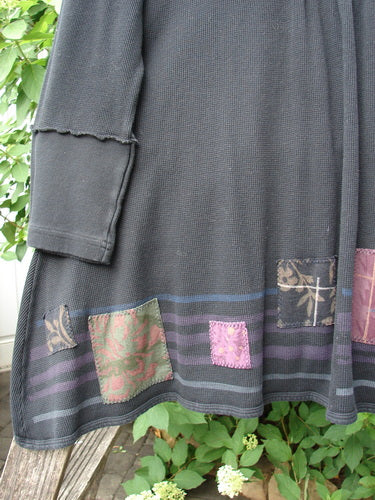 Barclay Patched Thermal Single Button Cardigan Tiny Square Black Size 0 features colorful fabric patches on a black waffle-knit fabric, with a bohemian touch from layered cuffs and horizontal stripes.