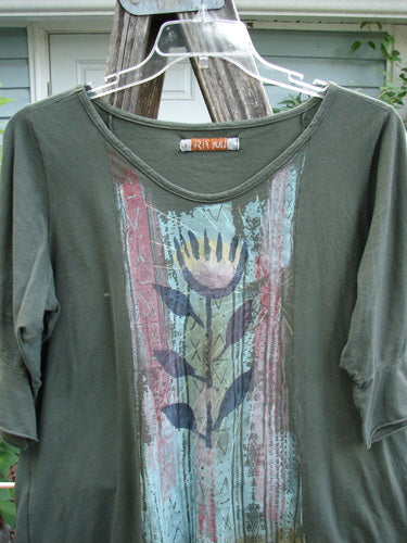 Barclay Three Quarter Sleeved Flutter Top Tulip Hunter Size 1 features a soft A-line shape, rounded hem, and three-quarter sleeves, showcasing a single tulip design in lightweight organic cotton.