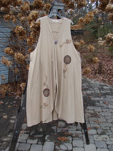 1996 State Fair Vest with oversized button, double paneled hemline, and abstract turning wheel design. Made from organic cotton. Size 2.