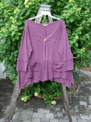 Barclay Patched Thermal Single Button Cardigan Tiny Square Murple Size 1 displayed on a hanger, featuring a single button closure, gathered pockets, and square-studded embellishments, with an asymmetrical hem.