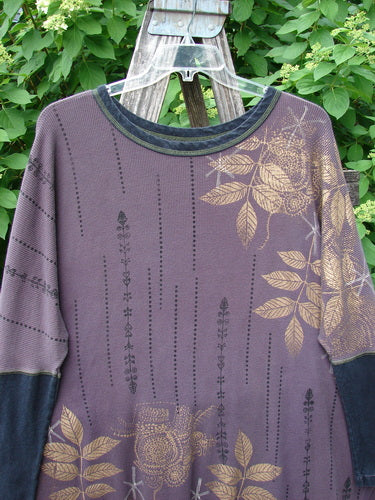 Barclay Thermal Contrast Revival Top Metallic Leaf Brum OSFA displayed on a wooden stepladder features ribbed sleeves, a contrasting neckline, and gold-toned botanical prints, reflecting Bluefishfinder.com's vintage aesthetic.